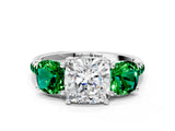White gold Three-Stone Cushion Cut Diamond Ring with Round with Emerald side stone Pavé Band and Prong Setting