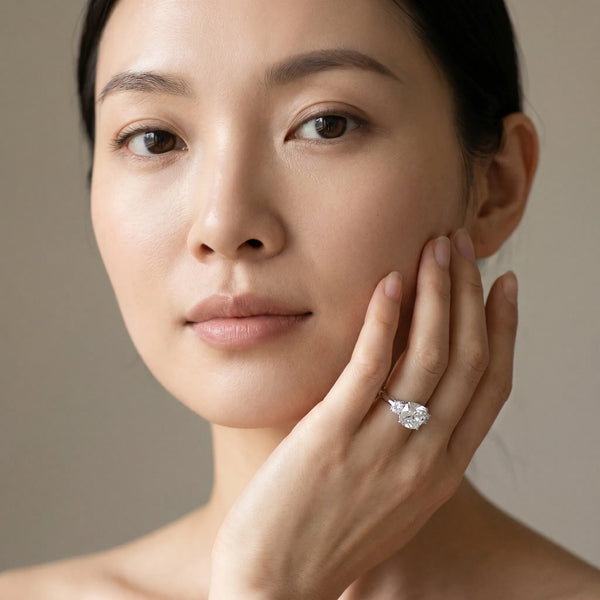 White gold Three-Stone Cushion Cut Diamond Solitaire with Prong Setting and Classic Band