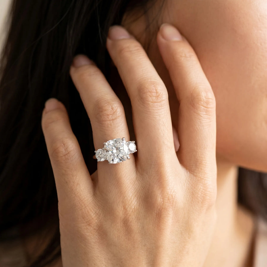 White gold Three-Stone Cushion Cut Diamond Solitaire with Prong Setting and Classic Band