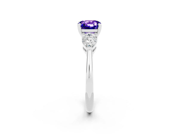 Silver Three-Stone Cushion Cut Tanzanite Ring with Pear Side Stones and Four-Prong Setting