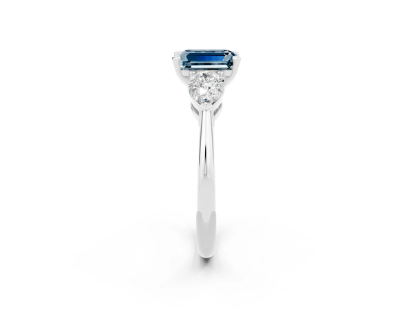 White gold Three-Stone Emerald Cut Aquamarine Ring with Pear Side Stones and Four-Prong Setting