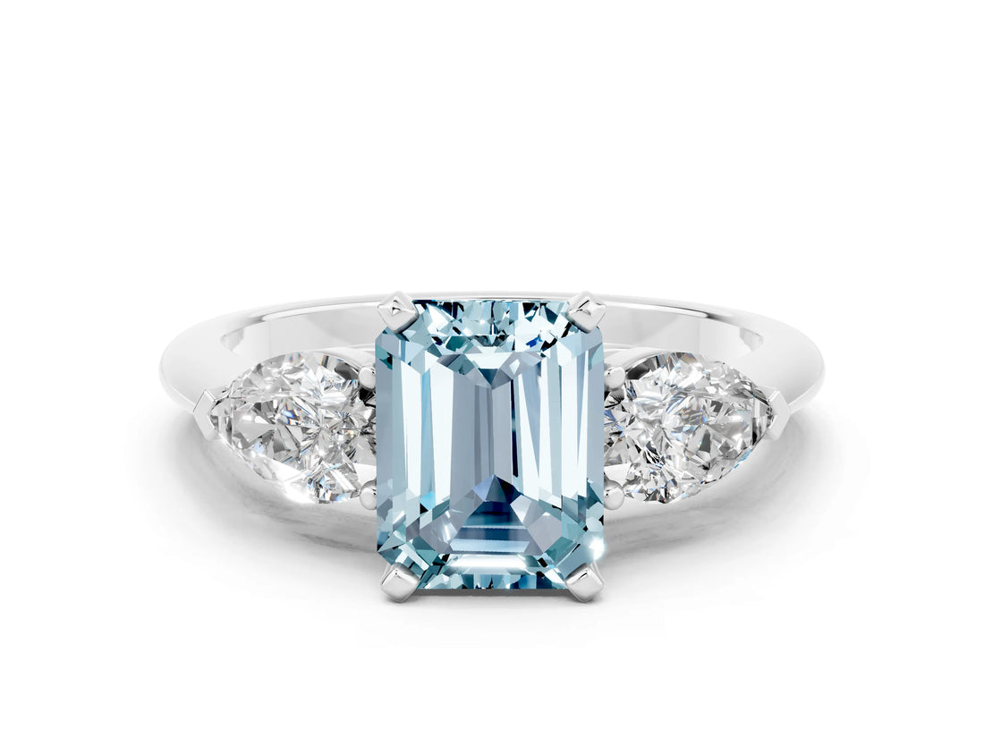 White gold Three-Stone Emerald Cut Aquamarine Ring with Pear Side Stones and Four-Prong Setting