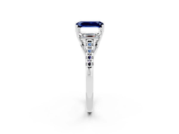 Platinum Three-Stone Emerald Cut Blue Sapphire Ring with Round  Pavé Band and Prong Setting