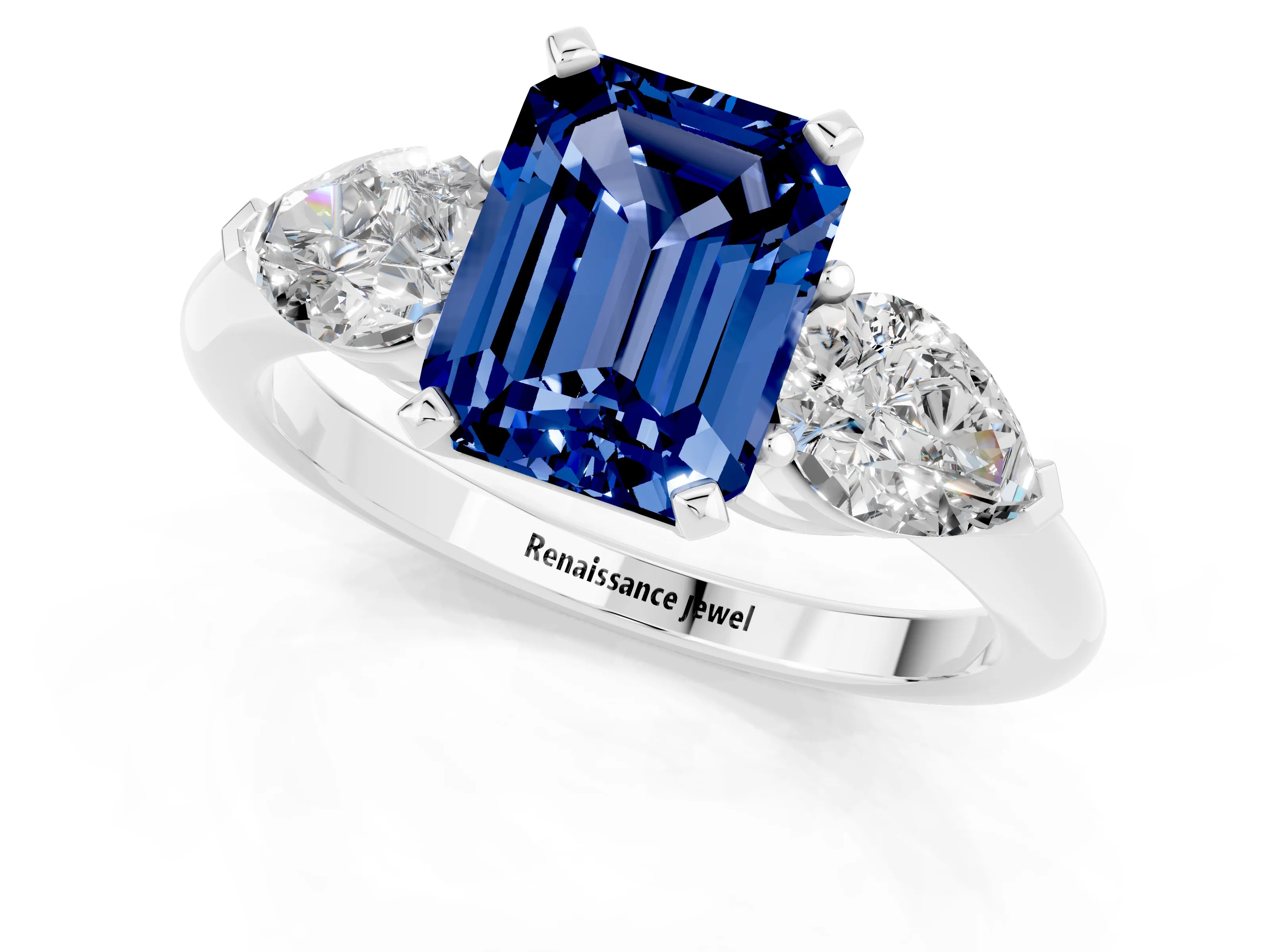 White gold Three-Stone Emerald Cut Blue Sapphire Ring with Pear Side Stones and Four-Prong Setting_1
