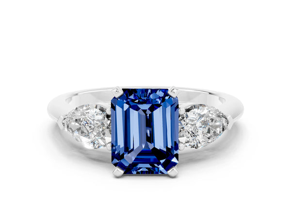 Silver Three-Stone Emerald Cut Blue Sapphire Ring with Pear Side Stones and Four-Prong Setting