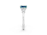 White gold Three-Stone Emerald Cut Blue Topaz Ring with Pear Side Stones and Four-Prong Setting_2