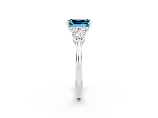 Silver Three-Stone Emerald Cut Blue Topaz Ring with Pear Side Stones and Four-Prong Setting