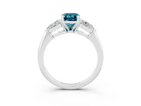 Silver Three-Stone Emerald Cut Blue Topaz Ring with Pear Side Stones and Four-Prong Setting