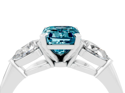 White gold Three-Stone Emerald Cut Blue Topaz Ring with Pear Side Stones and Four-Prong Setting_4