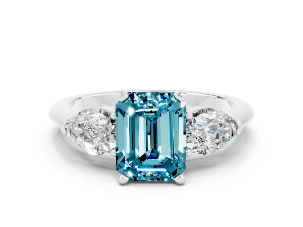 White gold Three-Stone Emerald Cut Blue Topaz Ring with Pear Side Stones and Four-Prong Setting