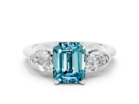 White gold Three-Stone Emerald Cut Blue Topaz Ring with Pear Side Stones and Four-Prong Setting