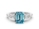 White gold Three-Stone Emerald Cut Blue Topaz Ring with Pear  Side Stones in Four-Prong Setting_12
