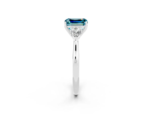 Platinum Three-Stone Emerald Cut Blue Topaz Ring with Pear  Side Stones in Four-Prong Setting