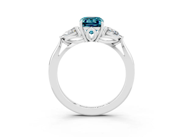 Platinum Three-Stone Emerald Cut Blue Topaz Ring with Pear  Side Stones in Four-Prong Setting