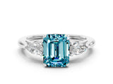 White gold Three-Stone Emerald Cut Blue Topaz Ring with Pear  Side Stones in Four-Prong Setting_48