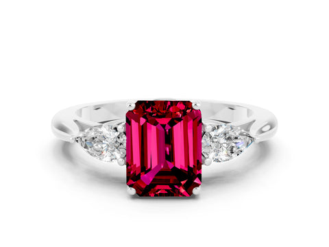 White gold Three-Stone Emerald Cut Cut Diamond Ring with Pear Side Stones in Four-Prong Setting