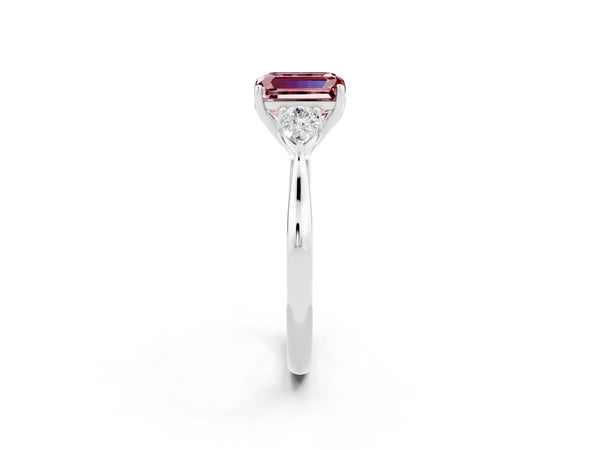 White gold Three-Stone Emerald Cut Cut Diamond Ring with Pear Side Stones in Four-Prong Setting