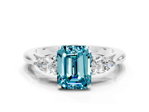White gold Three-Stone Emerald Cut Cut Diamond Ring with Pear Side Stones in Four-Prong Setting