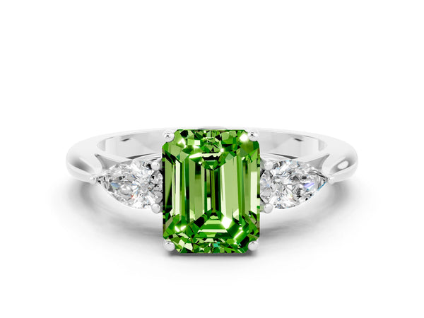 White gold Three-Stone Emerald Cut Cut Diamond Ring with Pear Side Stones in Four-Prong Setting
