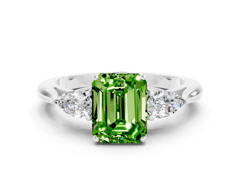 White gold Three-Stone Emerald Cut Cut Diamond Ring with Pear Side Stones in Four-Prong Setting
