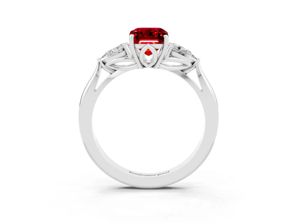 Silver Three-Stone Emerald Cut Cut Diamond Ring with Pear Side Stones in Four-Prong Setting