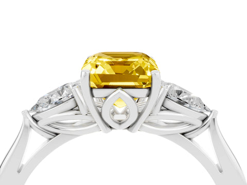 White gold Three-Stone Emerald Cut Cut Diamond Ring with Pear Side Stones in Four-Prong Setting_4