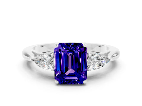 White gold Three-Stone Emerald Cut Cut Diamond Ring with Pear Side Stones in Four-Prong Setting