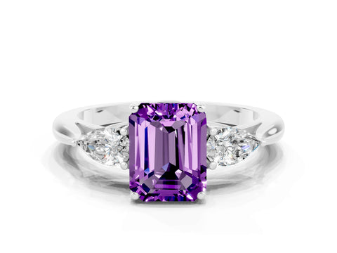 White gold Three-Stone Emerald Cut Cut Diamond Ring with Pear Side Stones in Four-Prong Setting