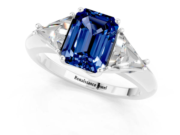 Platinum Three-Stone Emerald Cut Blue Sapphire Engagement Ring with Trillion Side Stones and Prong Setting