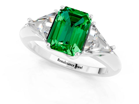 White gold Three-Stone Emerald Cut Cut Diamond Ring with Trillion Side Stones and Four-Prong Setting_1