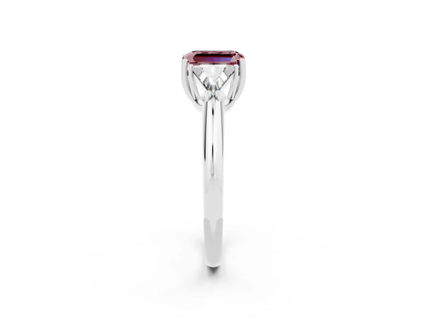 Silver Three-Stone Emerald Cut Cut Diamond Ring with Trillion Side Stones and Four-Prong Setting