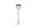 White gold Three-Stone Emerald Cut Cut Diamond Ring with Trillion Side Stones and Four-Prong Setting_2