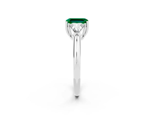 Silver Three-Stone Emerald Cut Emerald Engagement Ring with Trillion Side Stones and Prong Setting
