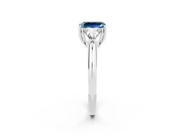 Silver Three-Stone Emerald Cut Aquamarine Engagement Ring with Trillion Side Stones and Prong Setting