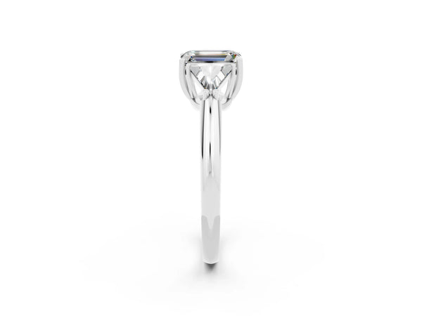 Platinum Three-Stone Emerald Cut Moissanite Engagement Ring with Trillion Side Stones and Prong Setting