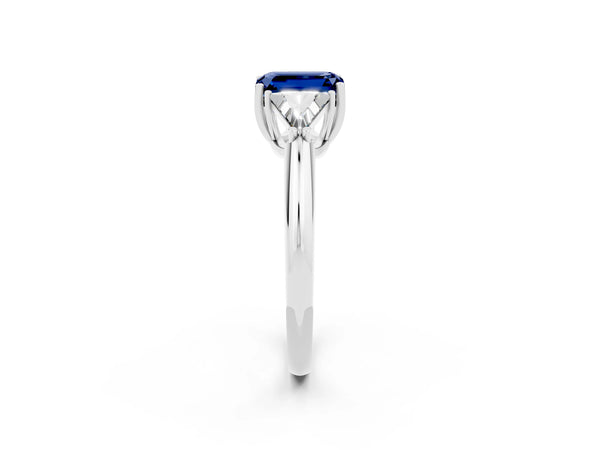 Silver Three-Stone Emerald Cut Blue Sapphire Engagement Ring with Trillion Side Stones and Prong Setting