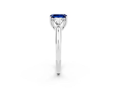 White gold Three-Stone Emerald Cut Cut Diamond Ring with Trillion Side Stones and Four-Prong Setting_2