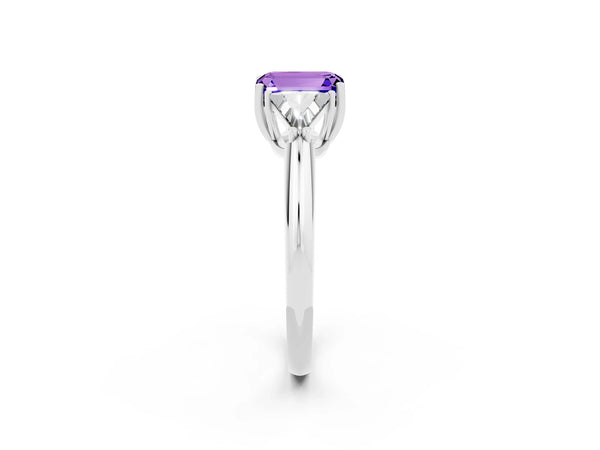 White gold Three-Stone Emerald Cut Tanzanite Engagement Ring with Trillion Side Stones and Prong Setting