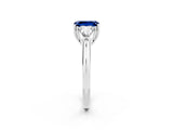 White gold Three-Stone Emerald Cut Cut Diamond Ring with Trillion Side Stones and Four-Prong Setting_2