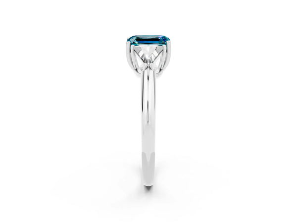 White gold Three-Stone Emerald Cut Cut Diamond Ring with Trillion Side Stones and Four-Prong Setting