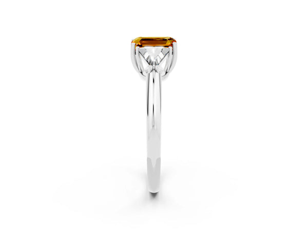 Silver Three-Stone Emerald Cut Cut Diamond Ring with Trillion Side Stones and Four-Prong Setting