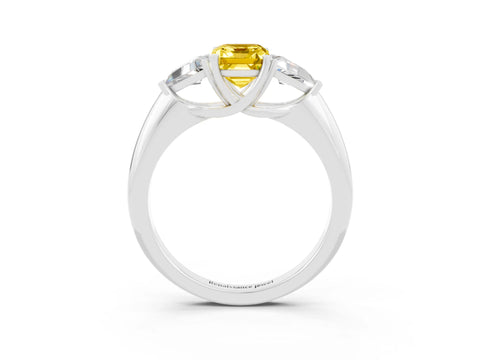 White gold Three-Stone Emerald Cut Cut Diamond Ring with Trillion Side Stones and Four-Prong Setting_3