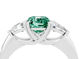 White gold Three-Stone Emerald Cut Cut Diamond Ring with Trillion Side Stones and Four-Prong Setting_4