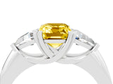 White gold Three-Stone Emerald Cut Cut Diamond Ring with Trillion Side Stones and Four-Prong Setting_4