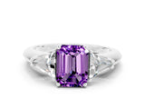 White gold Three-Stone Emerald Cut Cut Diamond Ring with Trillion Side Stones and Four-Prong Setting