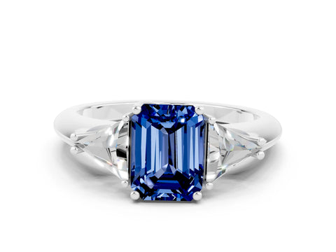 White gold Three-Stone Emerald Cut Cut Diamond Ring with Trillion Side Stones and Four-Prong Setting