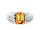 White gold Three-Stone Emerald Cut Cut Diamond Ring with Trillion Side Stones and Four-Prong Setting