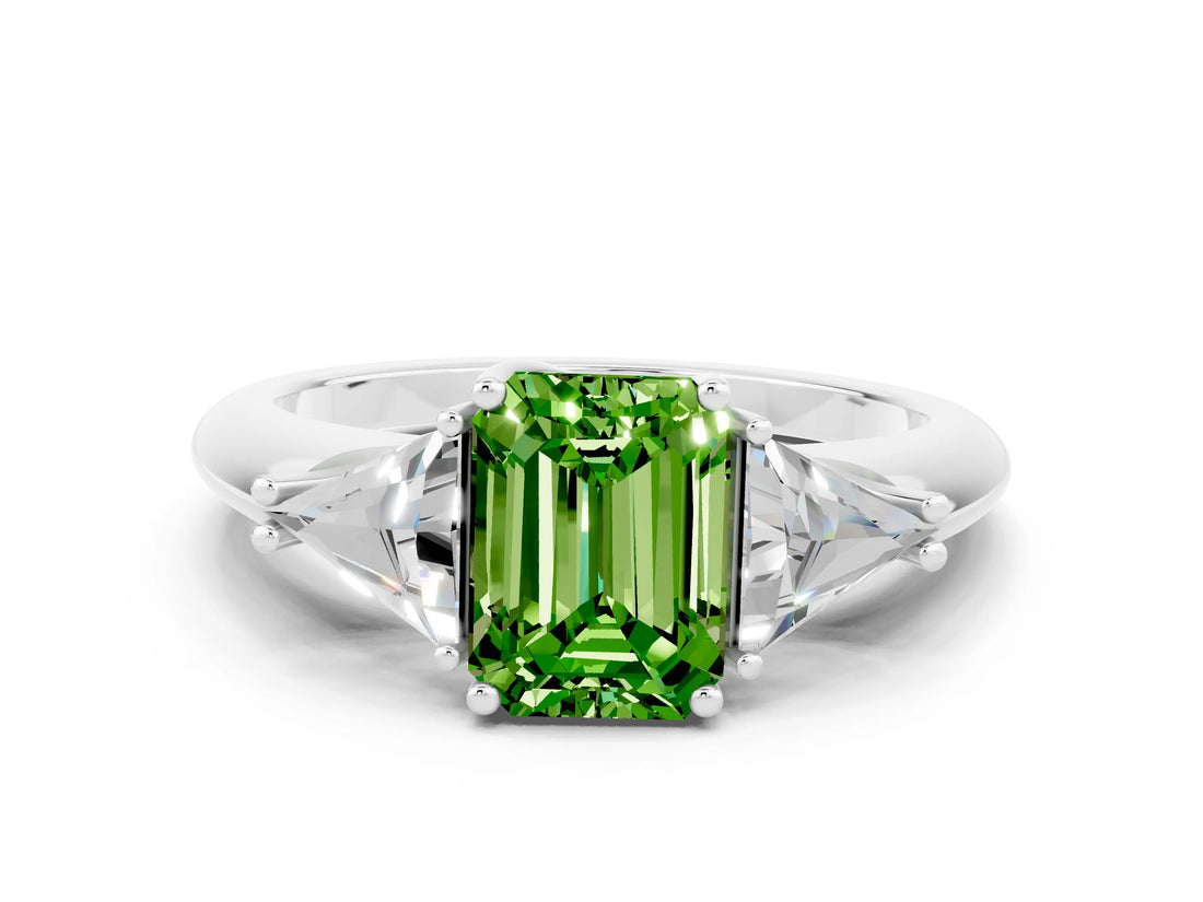White gold Three-Stone Emerald Cut Cut Diamond Ring with Trillion Side Stones and Four-Prong Setting