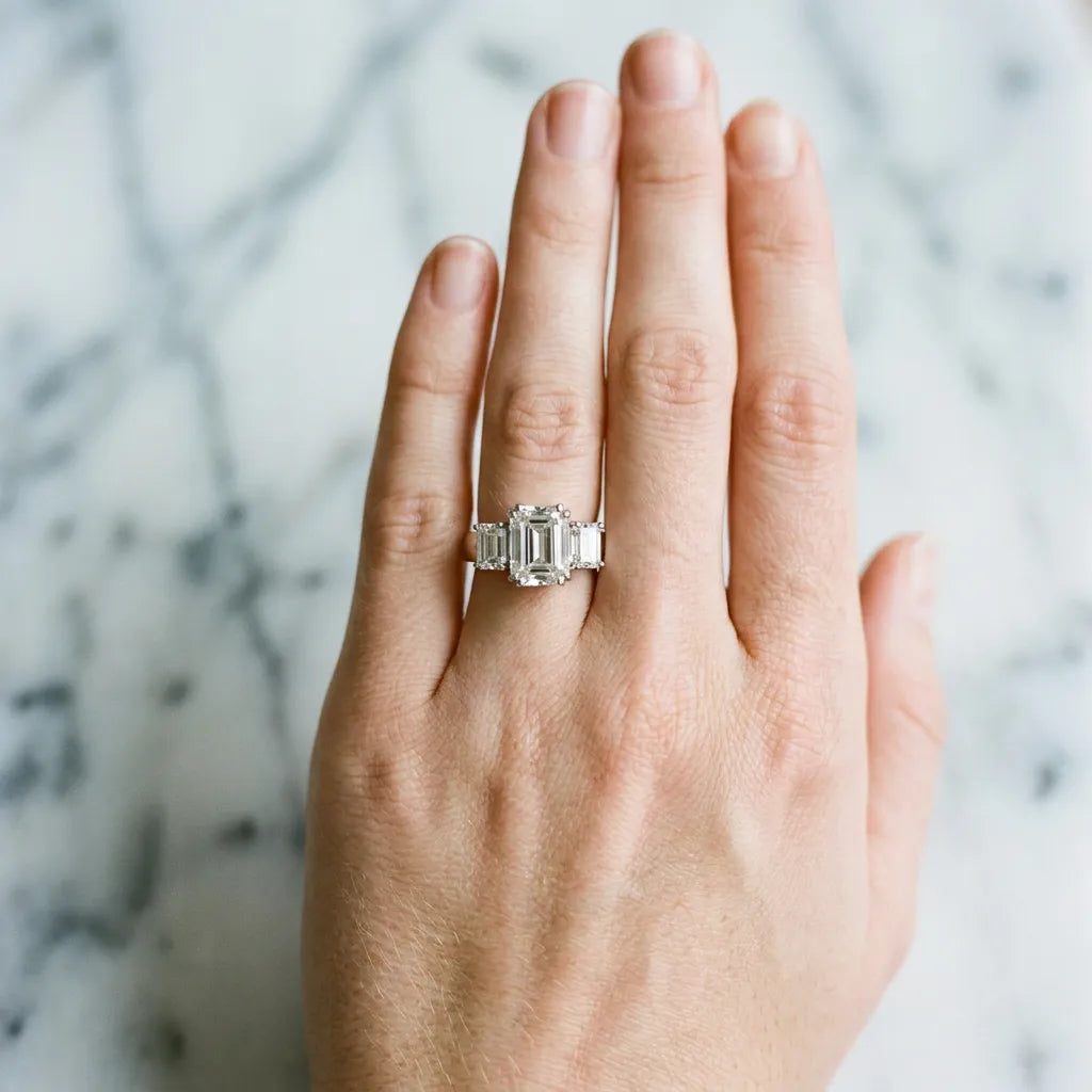 White gold Three-Stone Emerald Cut Diamond Ring with Channel Set Band and Four-Prong Setting_42