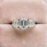 White gold Three-Stone Emerald Cut Diamond Ring with Channel Set Band and Four-Prong Setting_68